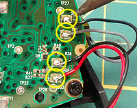 Solder points on the PCB for one side of the joypad motors.