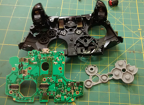 Xbox One removed PCB and rubber-boots removed.