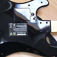 2. Flip the Guitar over so you can unscrew the black casing.