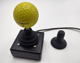 Wheelchair style joystick with yellow golf ball top.