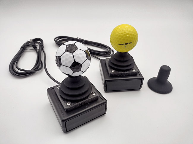 Wheelchair style USB joysticks. Football and yellow golf ball examples.