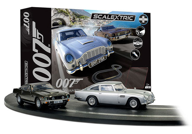 Scalextric box with track and two Aston Martins. A DB5 and a Vantage.