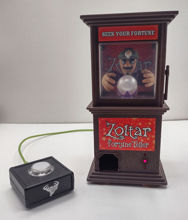 Zoltar Fortune Teller with crystal ball and accessibility switch.