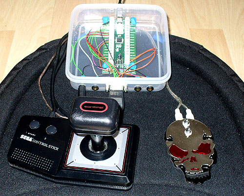 Image of a DIY AT Interface with SEGA Control Stick and Skull Tattoo pedal. Affordable asstive technology.