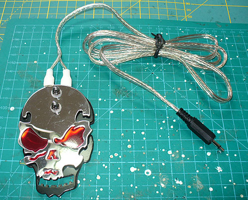 Image of a skull tattoo switch, adapted for use with switch adapted assistive technology.